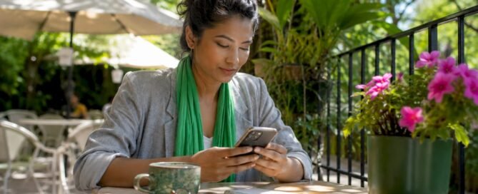 Woman using digital tipping app at café table