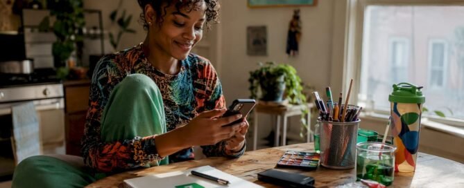 Young woman multitasking with phones and tablet at home