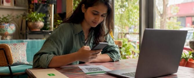 Freelancer scanning payment QR code at desk