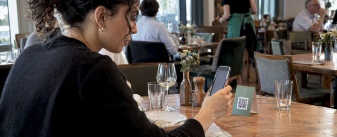 Hotel guest scanning a table QR code